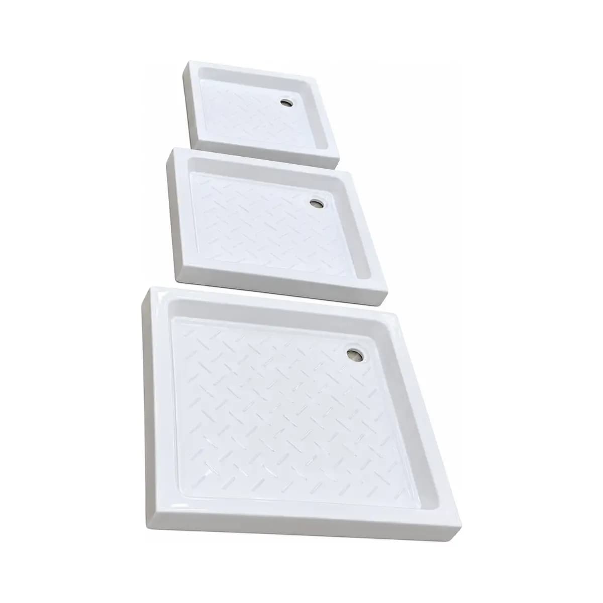 Three white rectangular trays with raised edges, drain holes and differing textured-looking surfaces.
