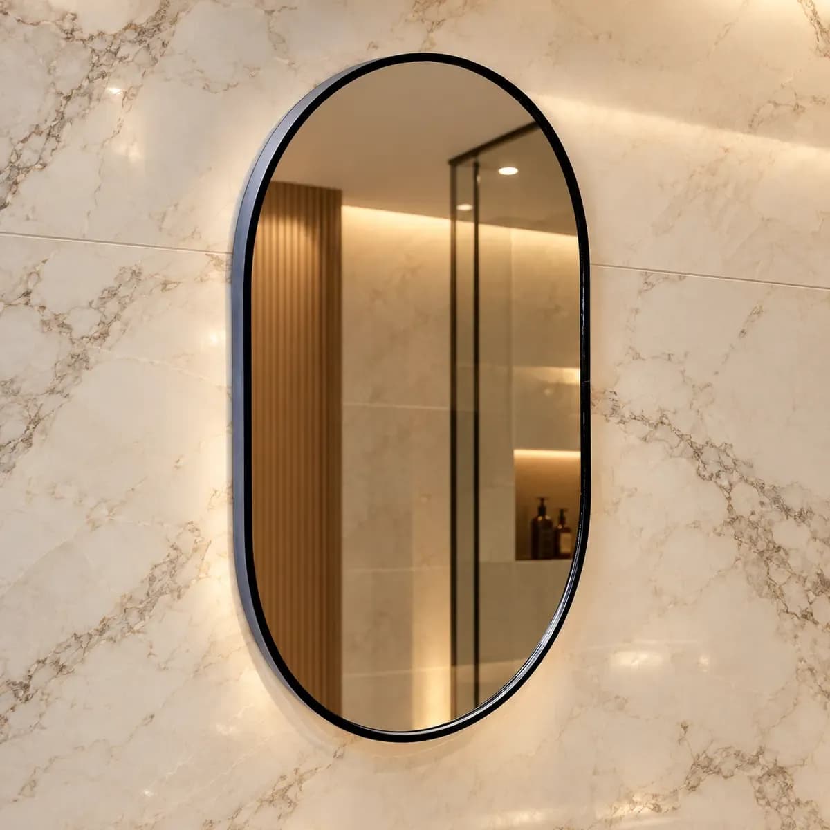 Upright oval mirror with a narrow dark frame.