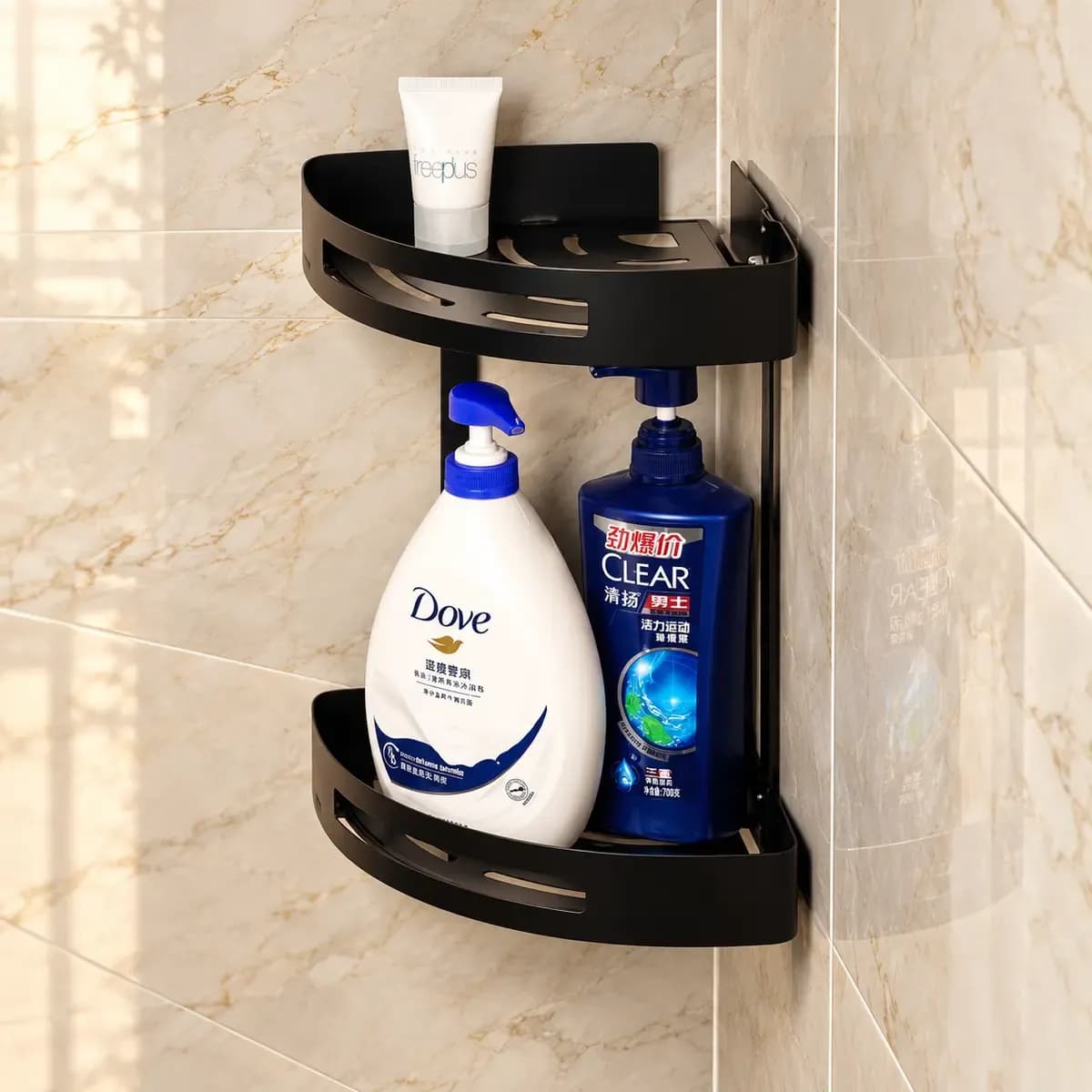 Black two-tier corner basket shown with toiletries as scene props.