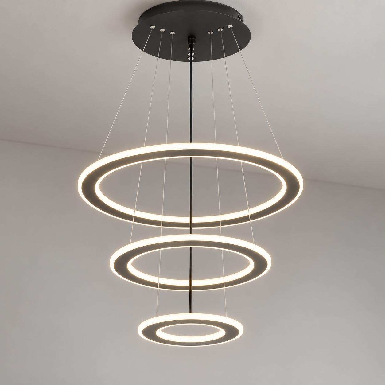Three-tier illuminated ring pendant with black round canopy